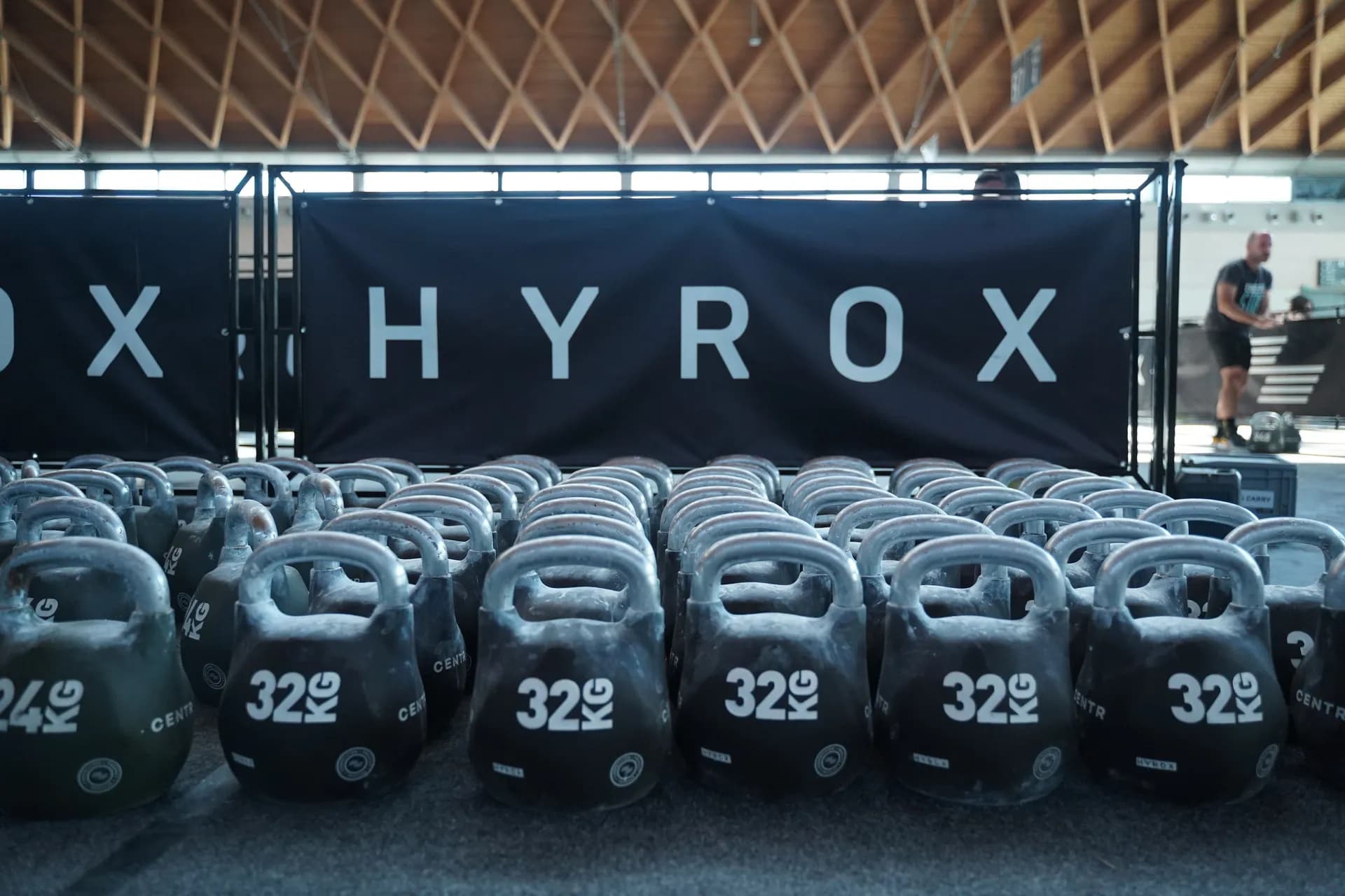 Richard Hynek pushing a loaded sled at a HYROX race